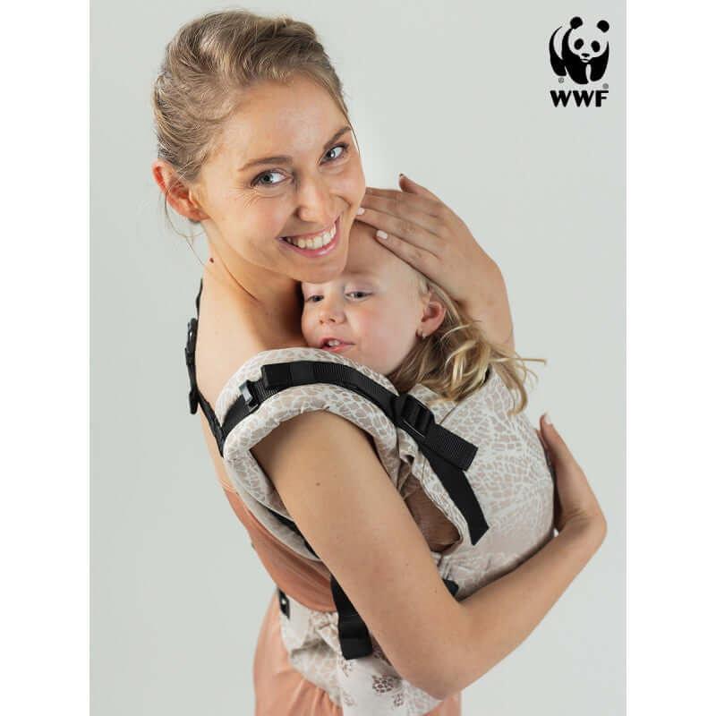 Isara The One - Majestic Ivory Forest baby carrier supporting a happy child, promoting comfort for all parents | Babymaxi