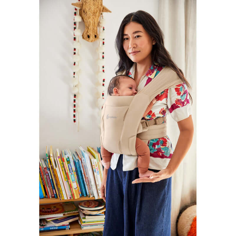 Ergobaby Embrace Soft Air Mesh - Cream baby carrier featuring a mother holding her baby comfortably | Babymaxi