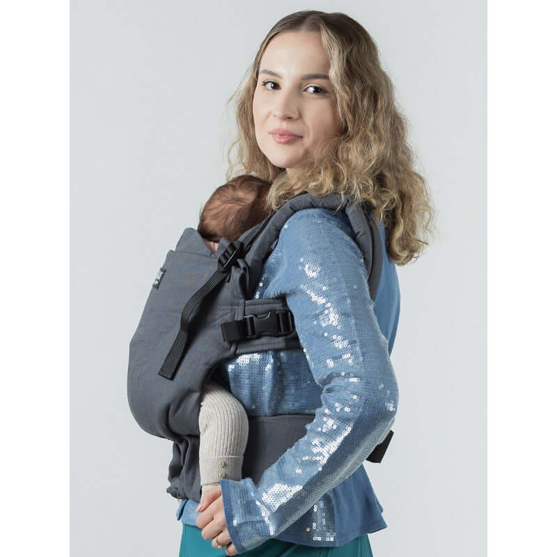 Isara The One - Graphite Linen baby carrier holding a child, showcasing comfort and versatility | Babymaxi