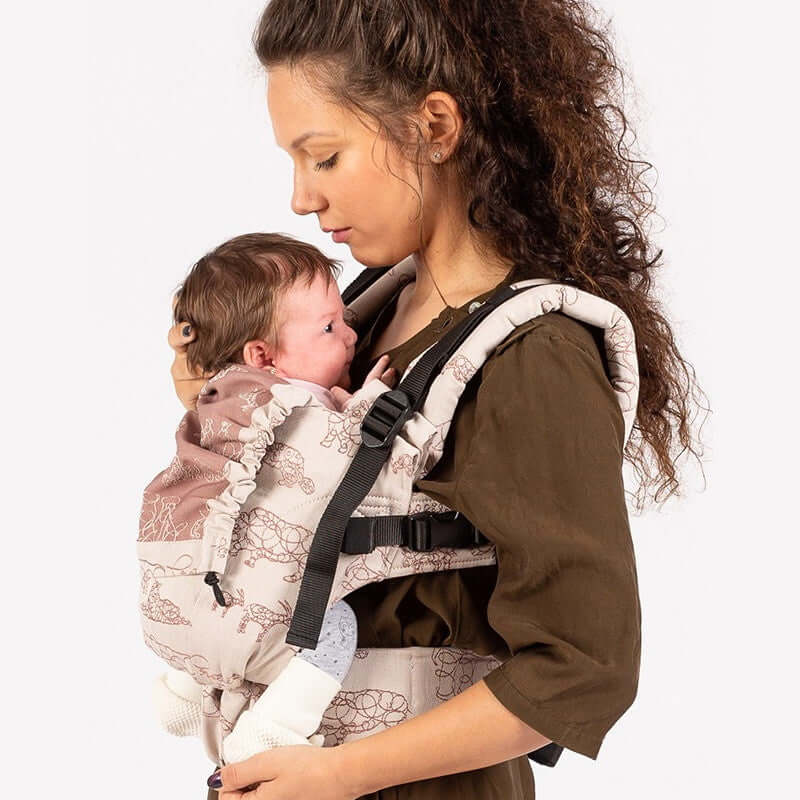 Isara The One - Wildlife Sandy, WWF Collaboration baby carrier with a mother holding her baby securely | Babymaxi