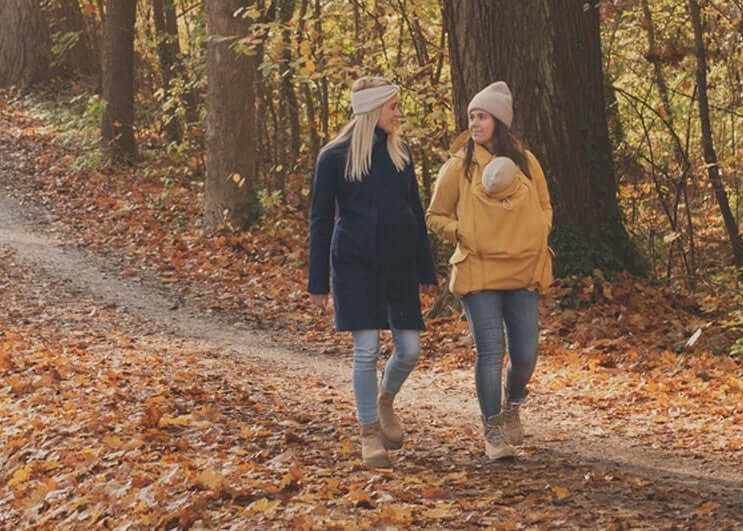 Mamalila Eco Wool Babywearing Coat Oslo - Camel worn by mothers in autumn park, showcasing babywearing style | Babymaxi