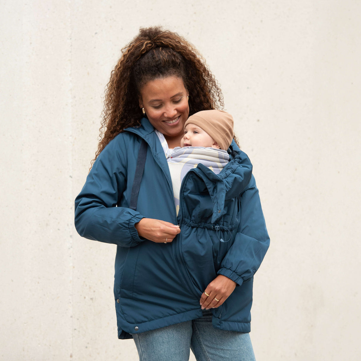 Mom wearing Mamalila Boston Babywearing Jacket - Navy with baby insert, stylish and cozy design | Babymaxi