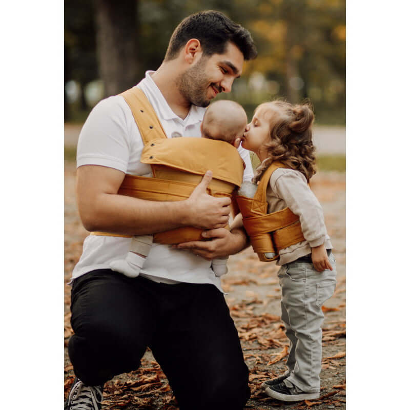 Father and children using Marsupi Classic - Butterscotch baby carrier outdoors | Babymaxi