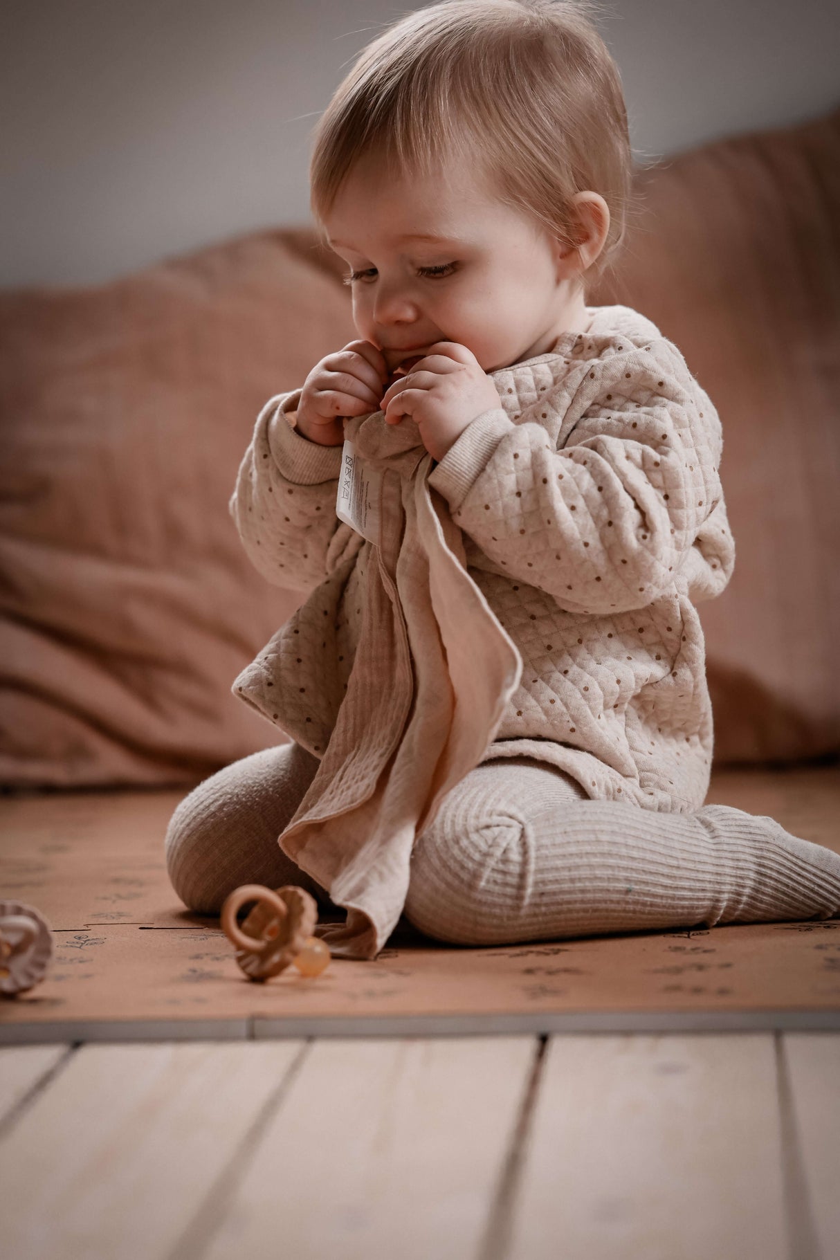 Baby enjoying the Organic Baby Teether & Activity Toy – Perfect for Carriers, soft muslin cloth and teething ring | Babymaxi