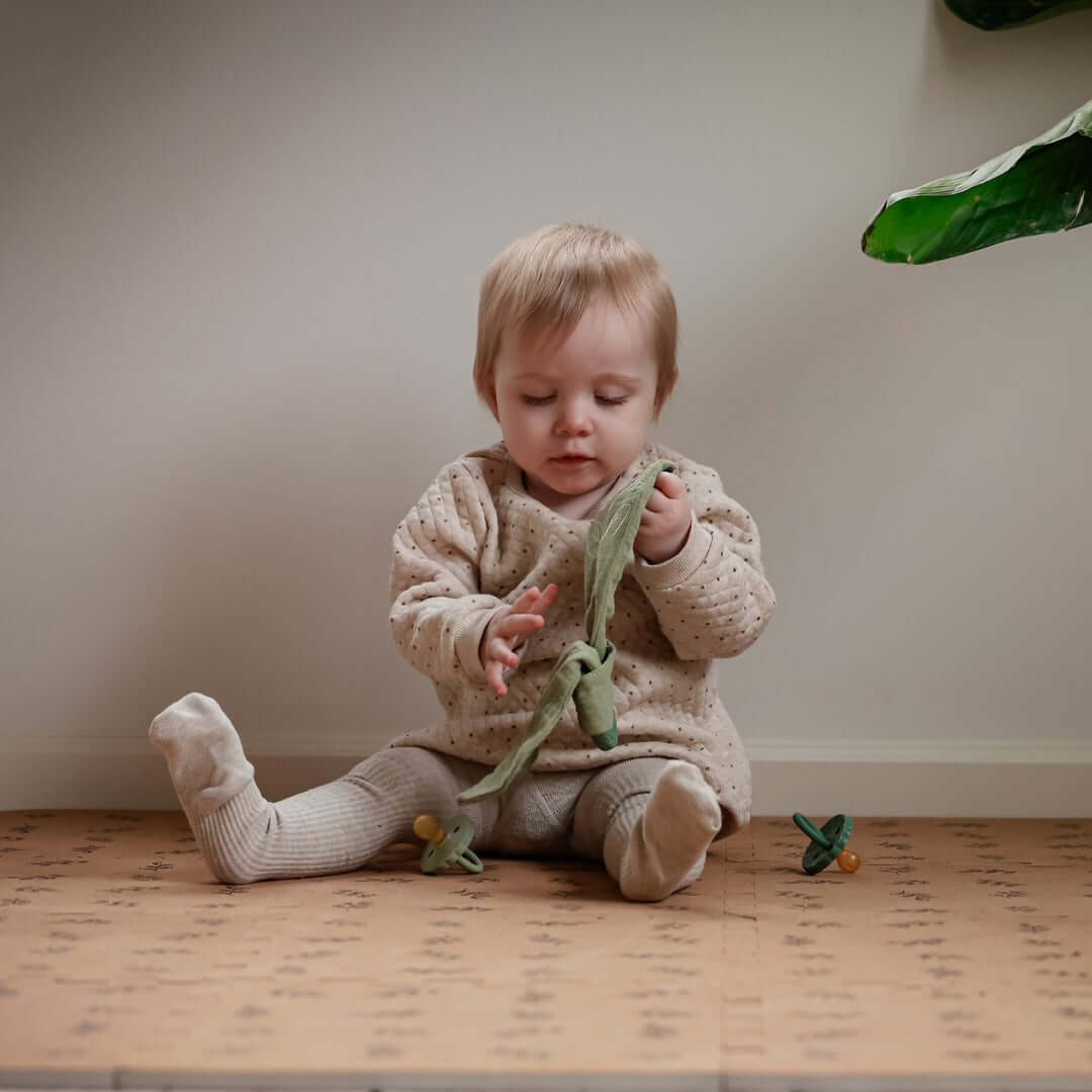 Organic Baby Teether & Activity Toy – Perfect for Carriers: baby playing with teething toy, ideal for babywearing | Babymaxi