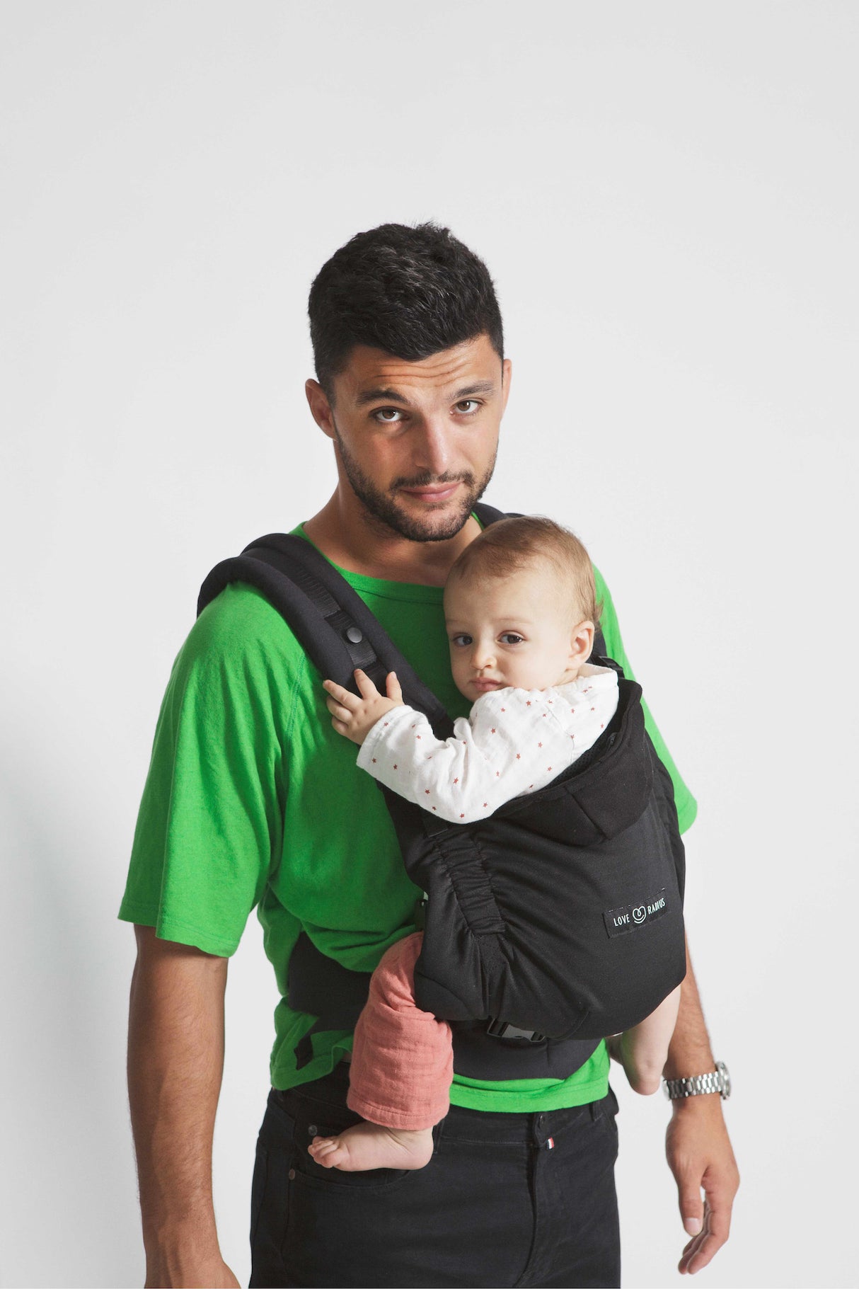 Love Radius HoodieCarrier 2 in black forest being used by a man with a baby, showcasing comfort and support.