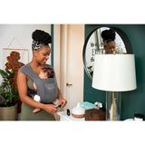 Mom using Ergobaby Embrace Soft Air Mesh - Washed Black baby carrier with newborn at home | Babymaxi