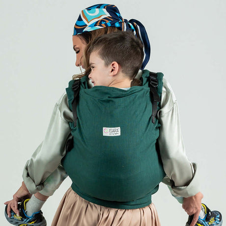 Isara Preschooler (up to 30kg) - Evergreen Linen baby carrier in use with child on back | Babymaxi
