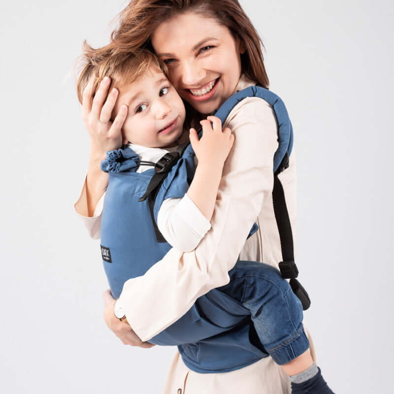 Isara The One - Bluestone ergonomic baby carrier with a joyful mother and child, showcasing comfort and support | Babymaxi