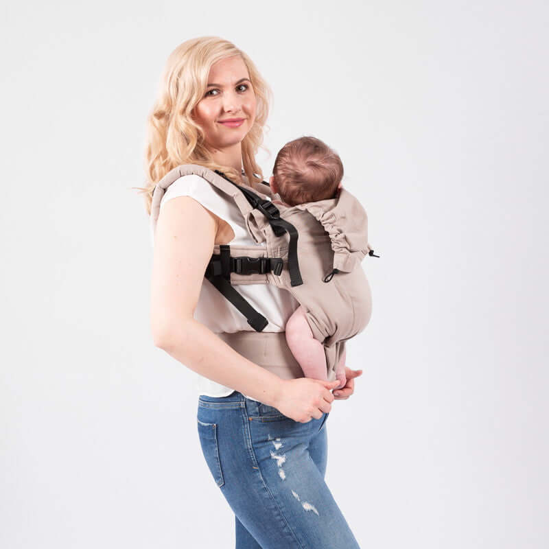 Isara The One - Caffe Latte baby carrier with mother carrying infant, adjustable ergonomic design, perfect for all adventures | Babymaxi