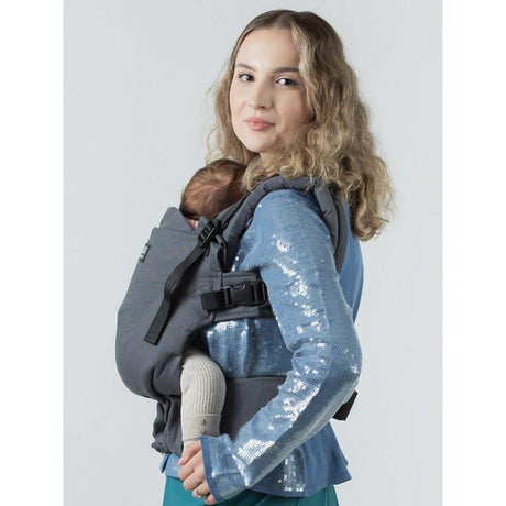 Isara The One - Graphite Linen baby carrier holding a child, showcasing comfort and versatility | Babymaxi