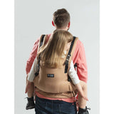 Isara The One - Macchiato baby carrier in use, supporting a child while providing comfort and ease for parents | Babymaxi