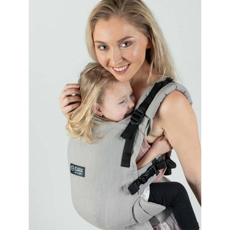 Isara The One - Misty Linen baby carrier in use, featuring a stylish sage green design for ultimate comfort and versatility | Babymaxi