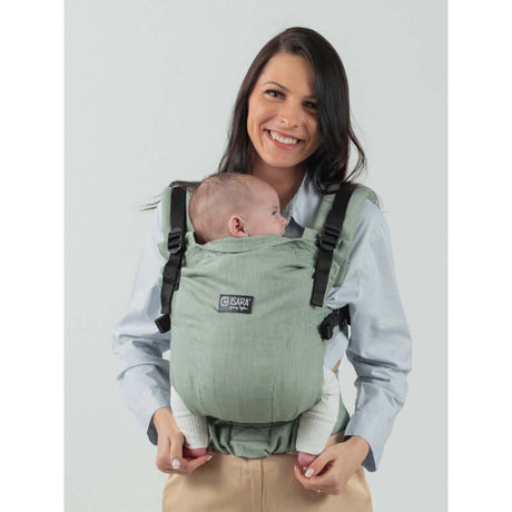 Isara The One - Sage Green Linen baby carrier worn by a smiling parent with a baby, showcasing soft, breathable fabric | Babymaxi