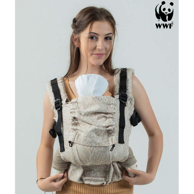 Isara The One - Majestic Ivory Forest baby carrier worn by a parent, showcasing its comfort and versatility | Babymaxi