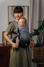 LennyLamb LennyLight - Little Herringbone Ombre Grey baby carrier with a smiling baby, lightweight and adjustable for comfort | Babymaxi