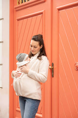 Mamalila Basel Baby Carrier Fleece Jacket – Off White in use, cozy mom with baby, perfect for cold weather walks | Babymaxi