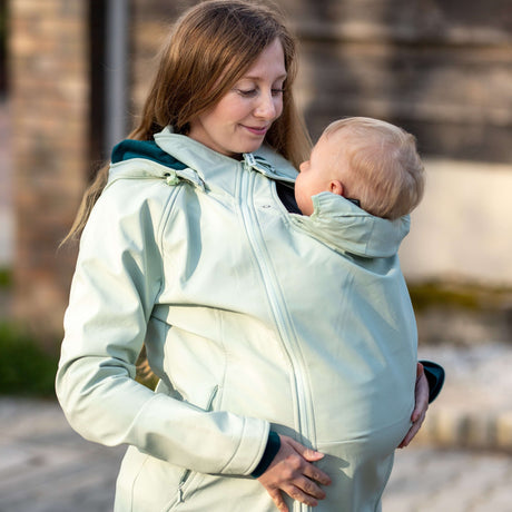 Mamalila Softshell Babywearing Jacket Allrounder - Mint in use by a mother carrying her baby | Babymaxi