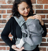 Neko Switch Baby Carrier - Bold, 2 extra hoods worn by a parent holding a baby, showcasing comfort and ergonomic design | Babymaxi