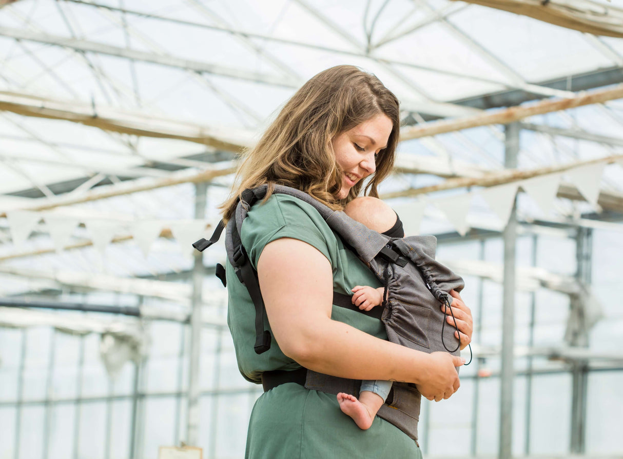 Mom wearing Neko Switch Baby Carrier - Bold, 2 extra hoods with baby inside, showcasing comfort and style | Babymaxi