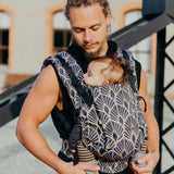 Father carrying baby in Neko Switch Baby Size - Kidonya Elegance carrier, perfect for comfort and support | Babymaxi