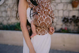 Neko Switch Baby Size - Mocha baby carrier worn by parent, featuring ergonomic design and stylish patterns | Babymaxi