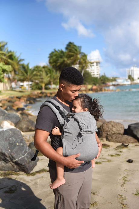 Neko Switch Toddler Carrier - Bold being used on a beach with a child, showcasing ergonomic comfort and adjustability | Babymaxi