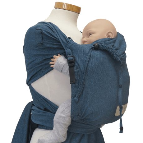Storchenwiege Bondima Wrap Baby Carrier - Turquoise on mannequin with baby, ergonomic, comfortable, adjustable straps | Babymaxi