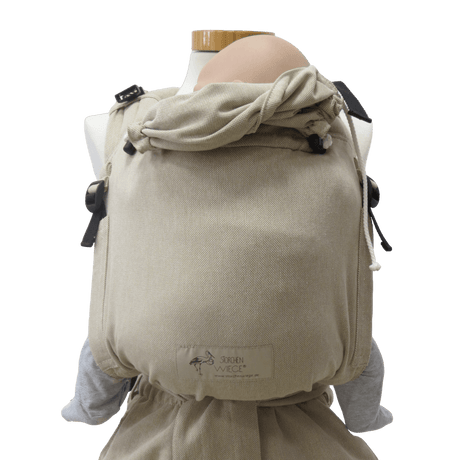 Storchenwiege Talemo Half-Buckle Baby Carrier - Natural showcased on a mannequin, highlighting its adjustable design and soft fabric | Babymaxi