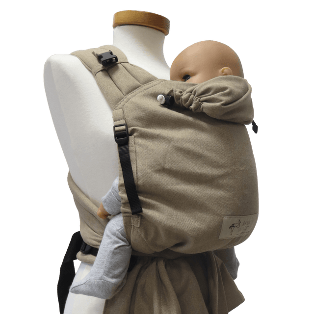 Storchenwiege Talemo Half-Buckle Baby Carrier - Sand on display with baby model | Babymaxi