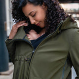 Wombat & Co. London - Shell Babywearing Coat - Camo Green worn by a mother carrying a baby | Babymaxi