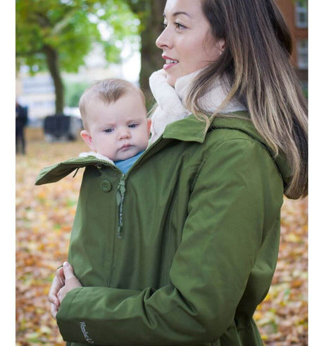 Wombat & Co. London - Wallaby Baby Carrier Jacket - Forest Green & Beige in use with baby in autumn park | Babymaxi